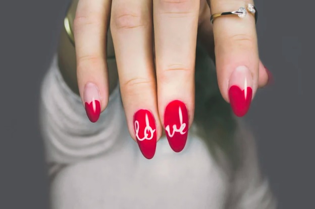 red gel nails with text
