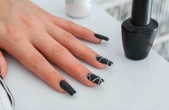 black nail art with white stripes
